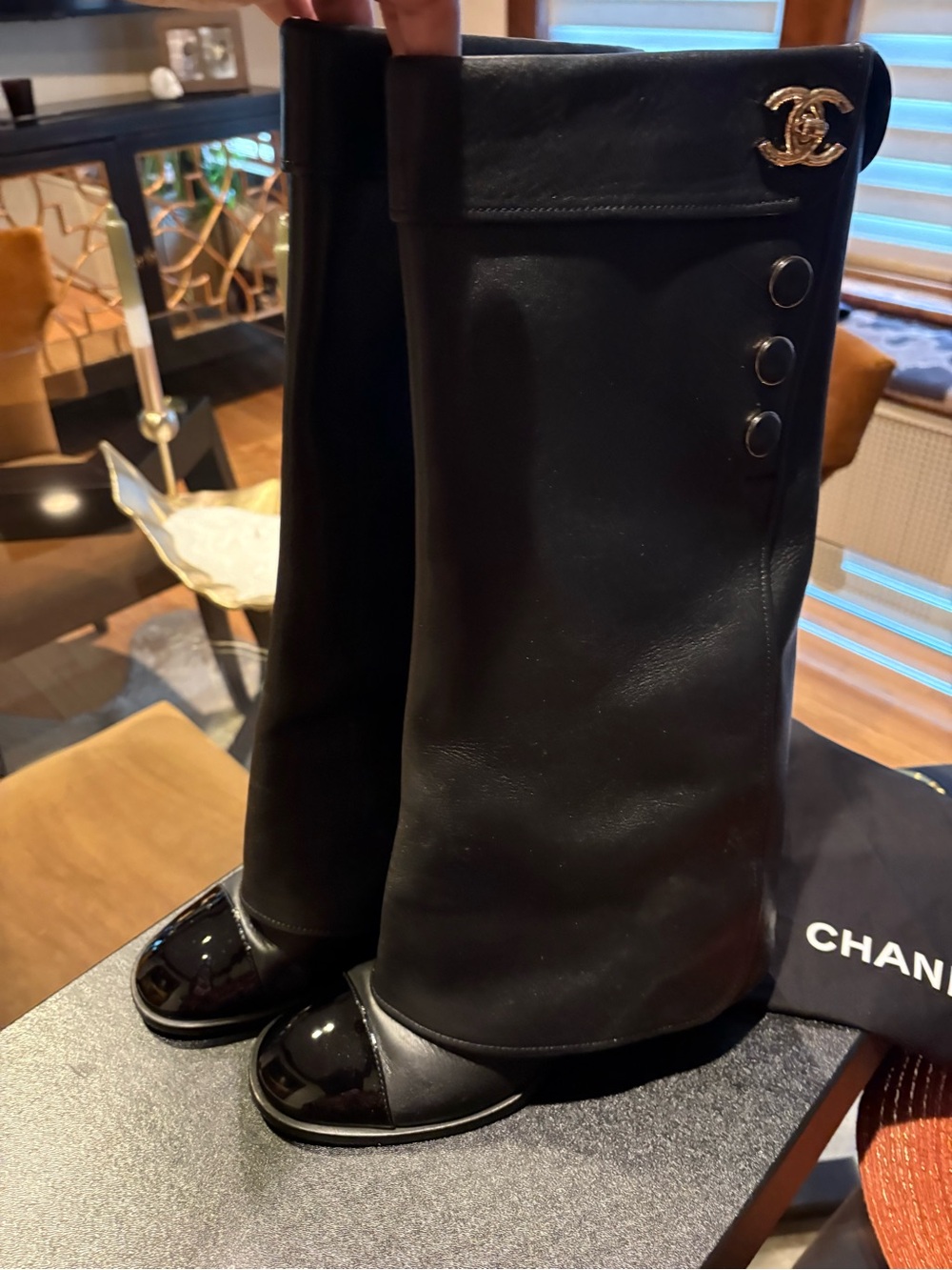 CHANEL Black Leather Knee-High Boots with Patent Cap Toe and CC Charm